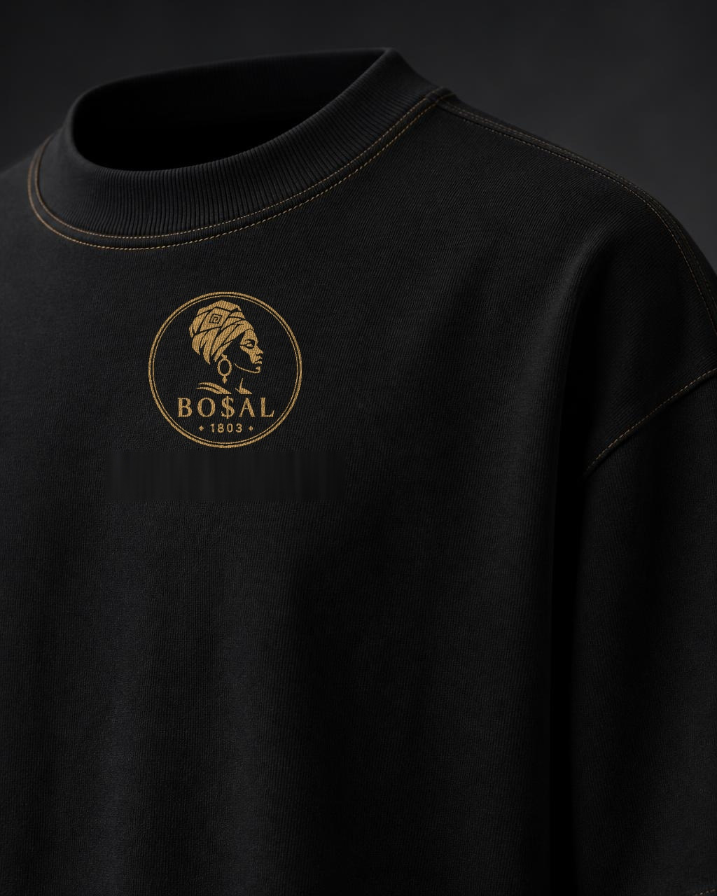 BO$AL Signature Heavyweight Tee — Jet Black / Antique Gold — BO$AL 1803 crest close-up