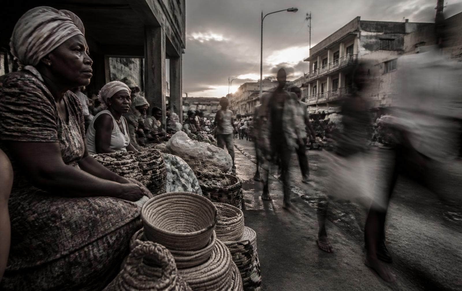 Market street at dawn, vendors and woven baskets